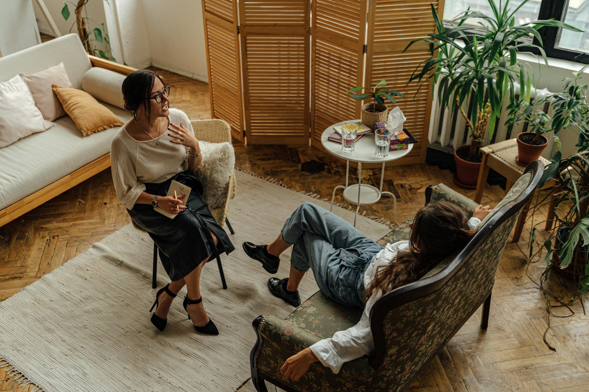 A clinician supporting a client during a home consultation